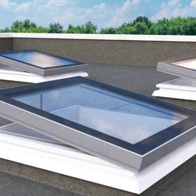 Mardome Glass Flat Roof Light powered opening with a  150mm PVC kerb